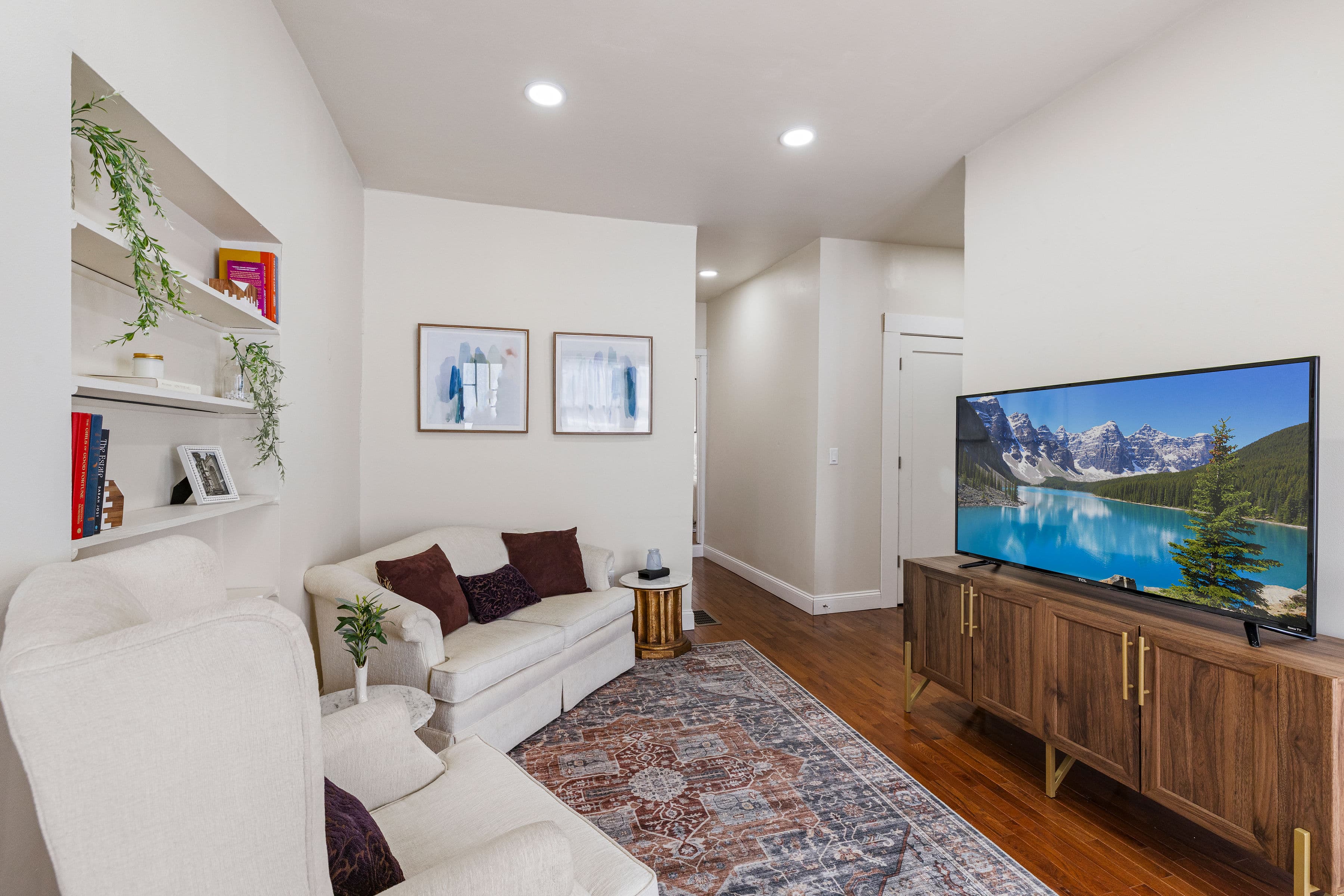 Furnished living room with hardwood floors